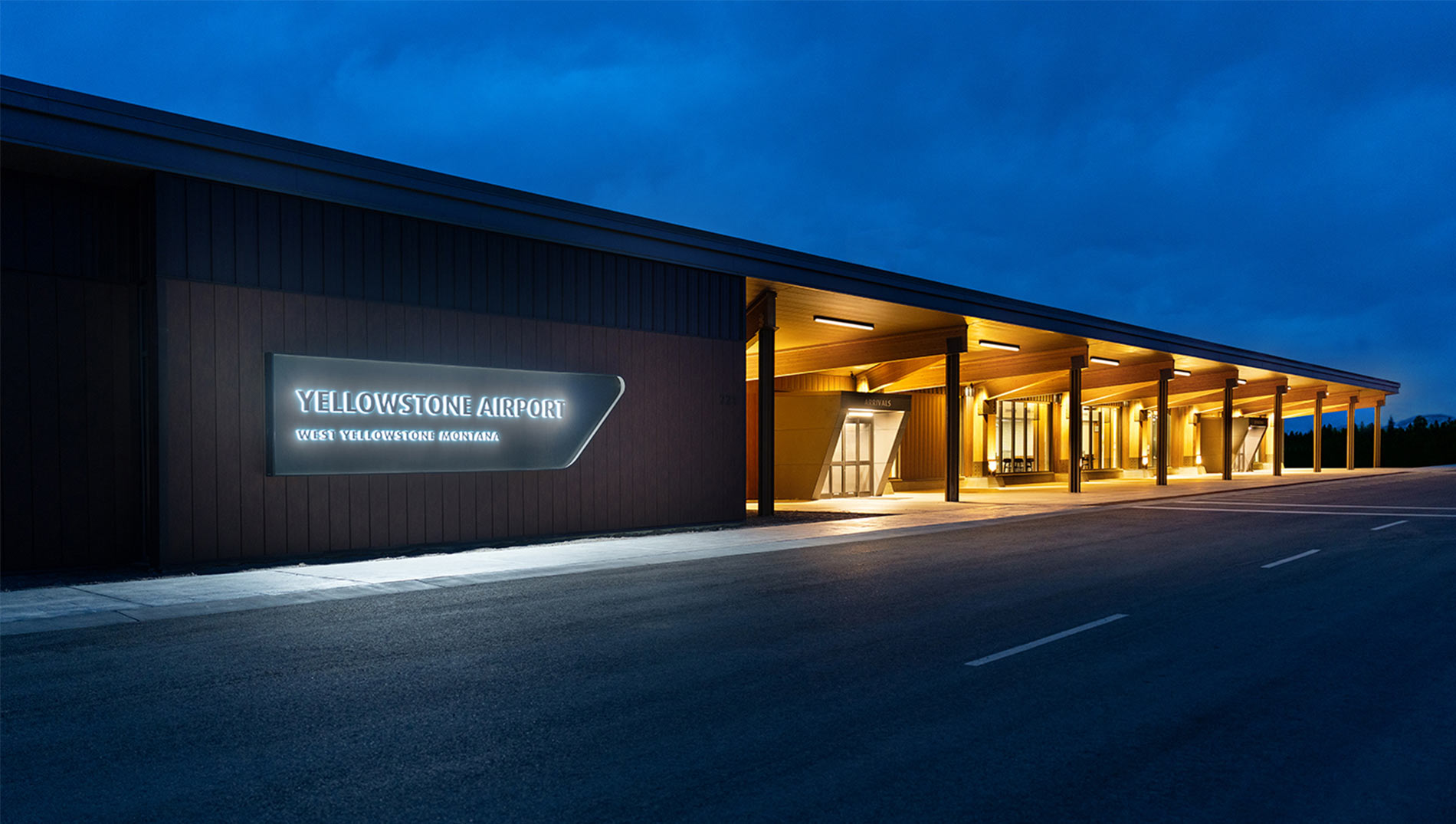 front of airport terminal reading Yellowstone Airport West Yellowstone, MT