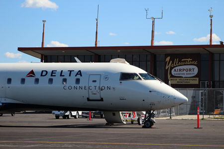Delta plane in front of Yellowstone Airport