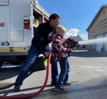Student holding the firefighting hose at WYS